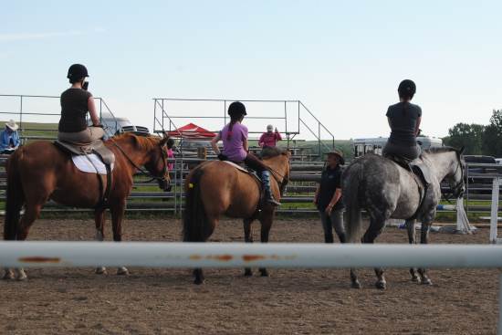 2014 July 10 4 Glynis Barnes teaching in the sand ring Michelle, Caitlyn and Cait.jpg