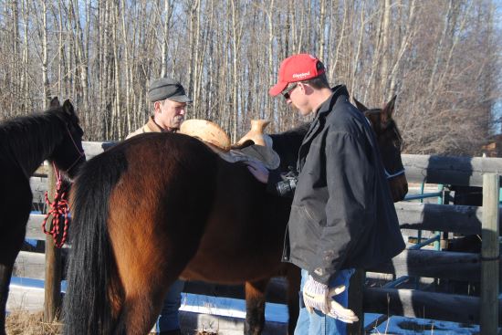 2016 July 26 7 Dusty Smith and Rod Nikkel checking out a tree on a horse.jpg