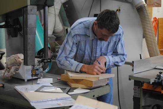 2016 July 26 2 Dusty Smith marking out a saddle tree.jpg