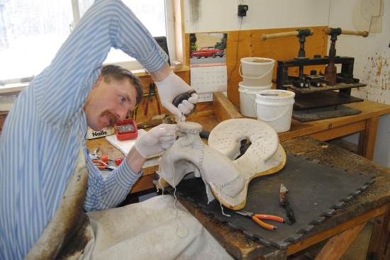 2016 July 26 4 Dusty Smith stitching on a saddle tree.jpg